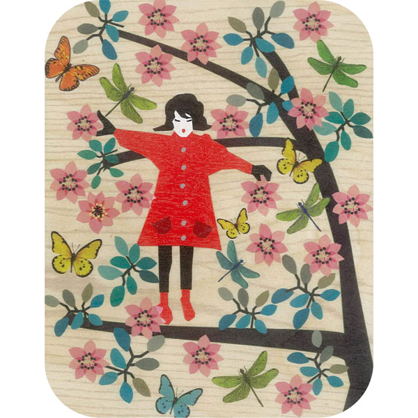 Wooden card girl balancing in tree