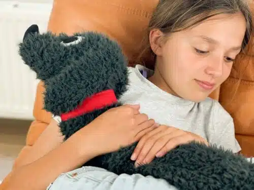 Bitten hot water bottle fluffy stretched dog